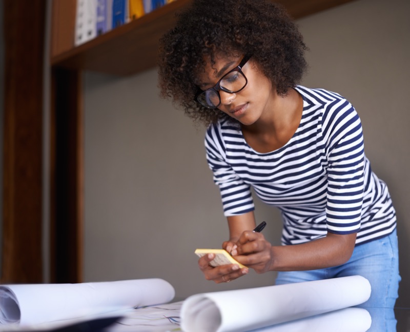 Young Woman Making Notes